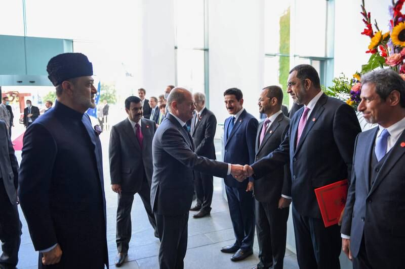Mr Scholz greets members of the Omani delegation alongside Sultan Haitham. 
