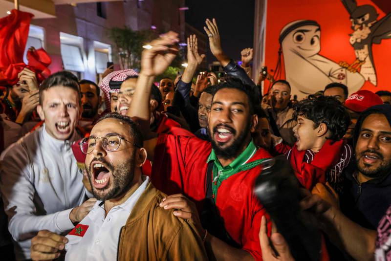 Morocco fans celebrate at Souq Waqif in Doha after their country's World Cup win over Portugal. AFP