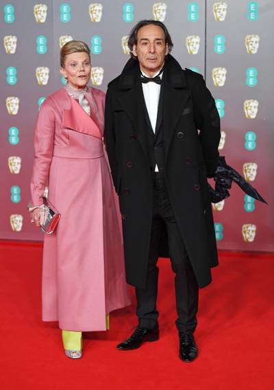 Alexandre Desplat and Dominique Lemonnier arrive at the 2020 EE British Academy Film Awards at London's Royal Albert Hall on Sunday, February 2. EPA