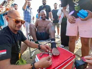 Shebab Allam has completed a 10.7km swim wearing handcuffs and leg irons in Dubai. All photos: Ruel Pableo / The National
