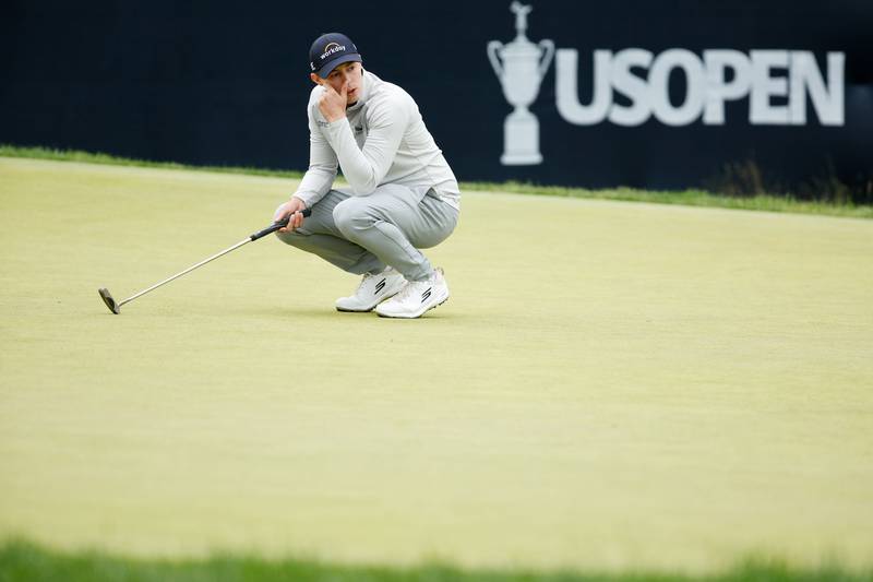 Matt Fitzpatrick of England reacts to a missed putt for birdie on the ninth green. AFP
