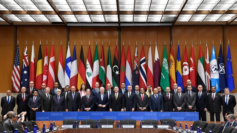 Secretary of Sate Mike Pompeo, center, and other foreign ministers and foreign officials pose for a family photo at the State Department in Washington, Thursday, Nov. 14, 2019, for the Global Coalition to Defeat ISIS Small Group Ministerial meeting. (AP Photo/Susan Walsh)