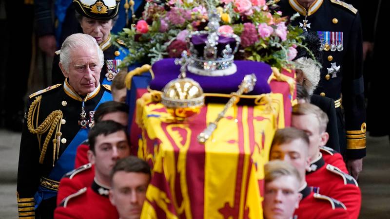 King Charles and members of the royal family follow the coffin of Queen Elizabeth as it is carried from Westminster Abbey after her state funeral. AP