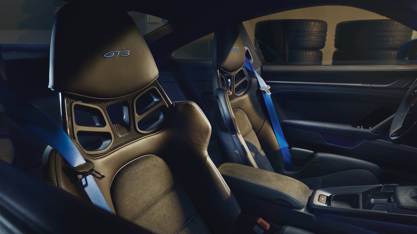 Seat options include a one-piece, leather-covered carbon-fibre shell that's ideal for the track and cushier, fully adjustable leather seats for more leg room. Photo: Porsche