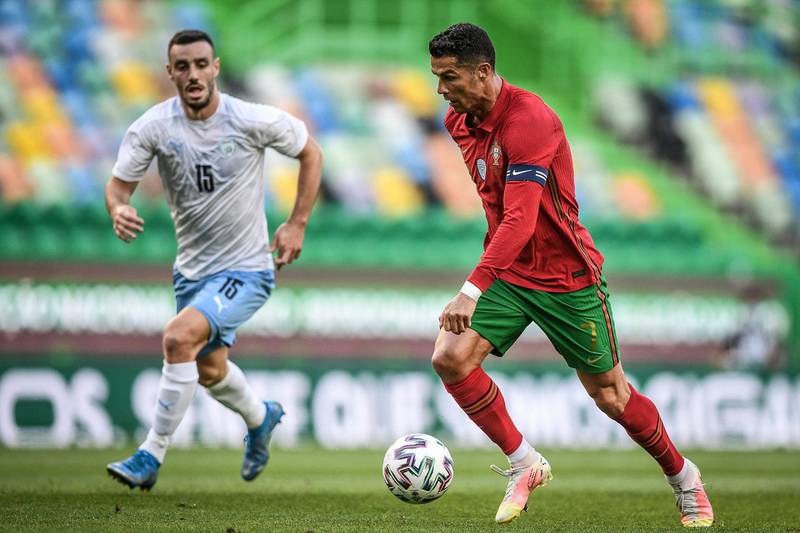 Portugal's Cristiano Ronaldo controls the ball next to Israel's Neta Lavi. AFP