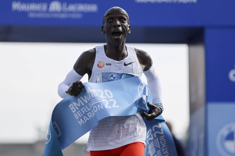 Kenya's Eliud Kipchoge crosses the line to win the Berlin Marathon in Berlin, Germany, Sunday, Sept.  25, 2022.  Olympic champion Eliud Kipchoge has bettered his own world record in the Berlin Marathon.  Kipchoge clocked 2:01:09 on Sunday to shave 30 seconds off his previous best-mark of 2:01:39 from the same course in 2018.  (AP Photo / Christoph Soeder)