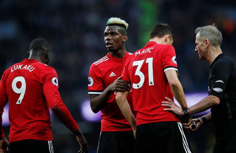 Soccer Football - Premier League - Manchester City vs Manchester United - Etihad Stadium, Manchester, Britain - April 7, 2018   (L - R) Manchester United's Romelu Lukaku, Paul Pogba, Nemanja Matic and referee Martin Atkinson                   Action Images via Reuters/Lee Smith    EDITORIAL USE ONLY. No use with unauthorized audio, video, data, fixture lists, club/league logos or "live" services. Online in-match use limited to 75 images, no video emulation. No use in betting, games or single club/league/player publications.  Please contact your account representative for further details.
