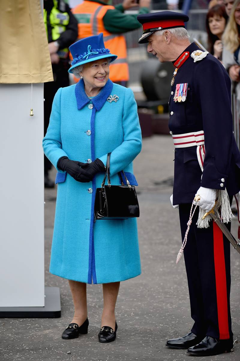 Queen Elizabeth II, wearing turquoise, opens Newtongrange Station on September 9, 2015, in Newtongrange, Scotland. Getty Images