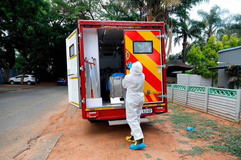 A City of Tshwane's Special Infection Unit paramedic closes the door of an ambulance in the north of Pretoria, South Africa. AFP