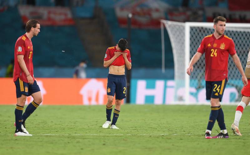 Spain's Pedri, centre, reacts after the Euro 2020 soccer championship group E match between Spain and Poland at La Cartuja stadium in Seville, Spain, Saturday, June 19, 2021. (David Ramos/Pool via AP)