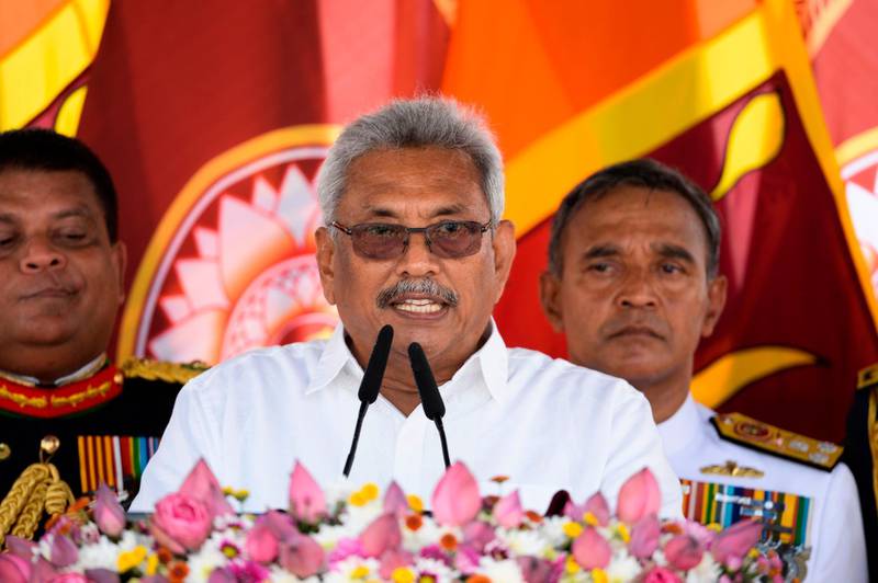 Sri Lanka's new president Gotabaya Rajapaksa (C) speaks after taking oath of office during his swearing-in ceremony at the Ruwanwelisaya temple in Anuradhapura on November 18, 2019. Sri Lanka's new president Gotabaya Rajapaksa was sworn in November 18 at a Buddhist temple revered by his core Sinhalese nationalist supporters, following an election victory that triggered fear and concern among the island's Tamil and Muslim minority communities. / AFP / Lakruwan WANNIARACHCHI
