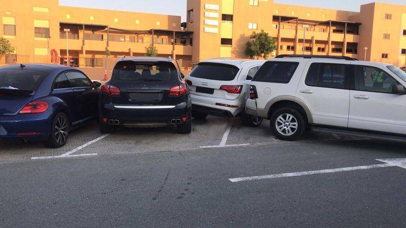 Police published this photograph showing a car had driven into other parked vehicles outside the school. Courtesy: Dubai Police