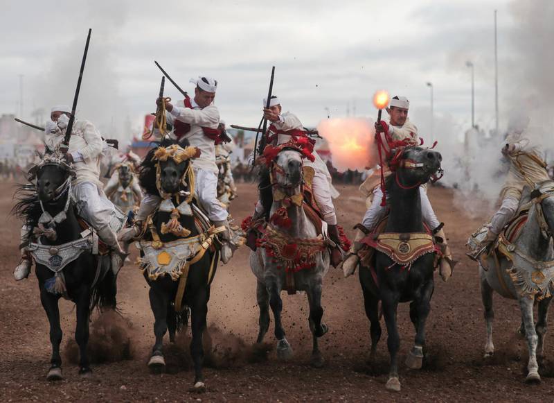 Thousands of visitors descended on the Moroccan coastal city of El Jadida this July to attend the largest equestrian show in the kingdom - a breathtaking horseback performance that combines synchronized riding with decorative guns. All photos: AP / Mosa'ab Elshamy