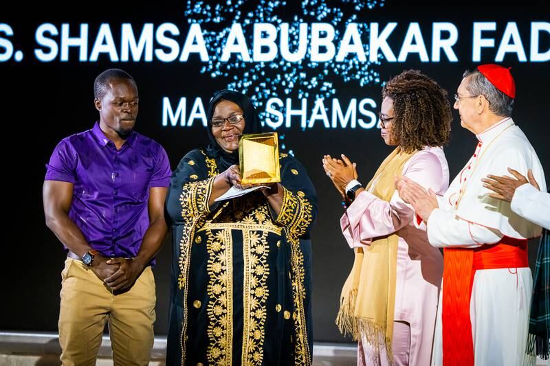 Shamsa Abubakar Fadhil accepts the Zayed Prize for Human Fraternity award. Wam