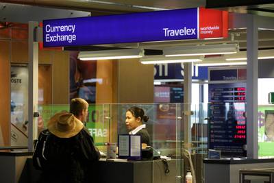 FILE - In this Monday, June 7, 2010, file photo, a Travelex Group currency exchange booth is shown at Seattle-Tacoma International Airport in Seattle. A week after a malicious virus infected its network, the London-based foreign currency exchange company Travelex has yet to restore digital sales and was reported infected with ransomware by hackers threatening to release personal data unless it pays a $3 million ransom. In a Jan. 2, 2020, Twitter post, the company said the virus had compromised some of its services on New Yearâ€™s Eve and that it took all systems offline immediately. (AP Photo/Ted S. Warren, File)