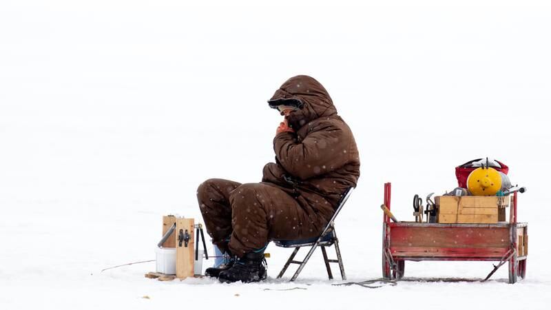 People category winner: 'Ice fishing on the frozen sea in Hokkaido, Japan' by Claire Waring