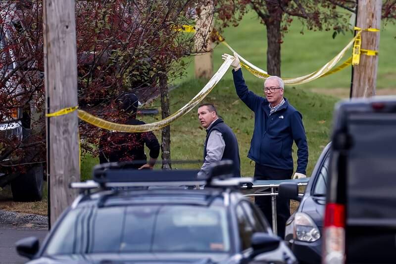 Law enforcement officers work outside Schemengees Bar and Grille, after a mass shooting in at least two places in Lewiston, Maine. EPA