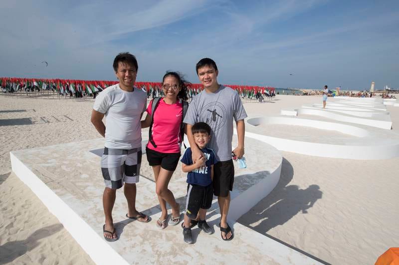 Rolando Ramos with his family at Kite Beach. Ruel Pableo for The National