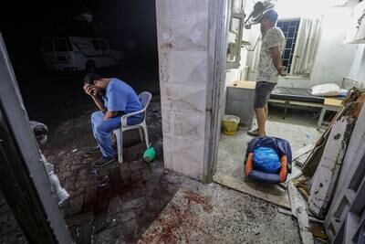 A doctor at Al Ahli Hospital after an air strike in Gaza city. EPA