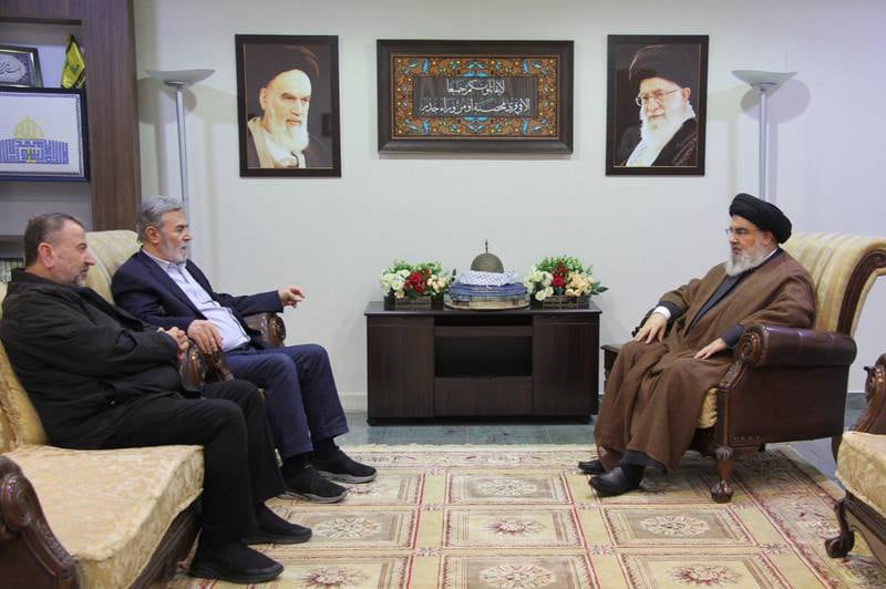 Hezbollah leader Hassan Nasrallah, right, with Palestinian Islamic Jihad secretary general Ziad Al Nakhalah, second left, and deputy leader of Hamas, Saleh Al Arouri. EPA