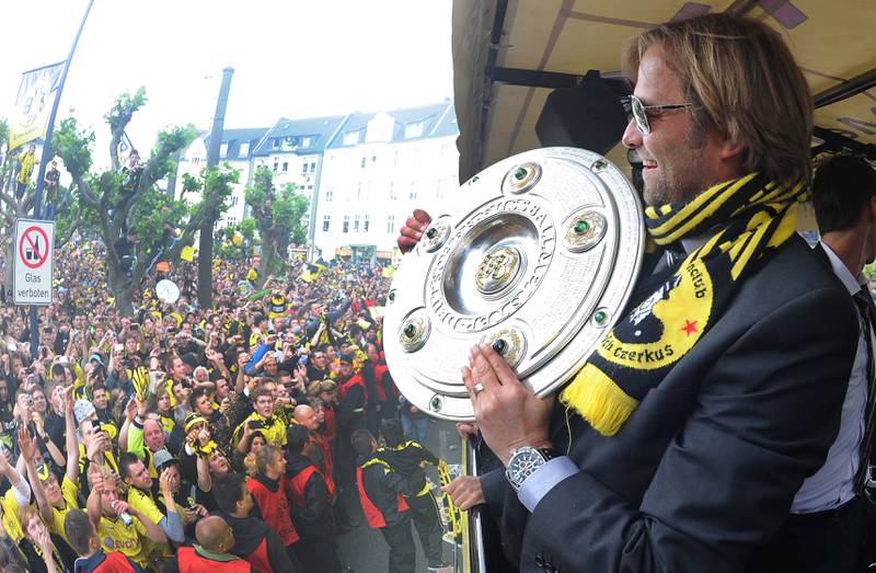 Borussia Dortmund coach Jurgen Klopp with the league title during a victory parade on May 15, 2011. AFP