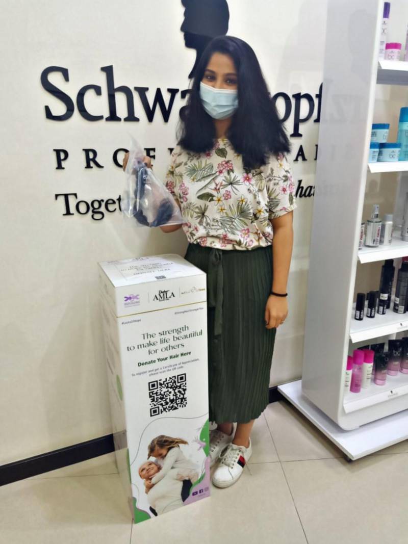 Irene James, 30, from India, was among 300 women who donated their hair to make wigs for cancer patients in the UAE. Dabur Amla