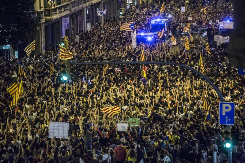 Demonstrators march through the city to protest against alleged police violence during Sunday's illegal referendum vote in Barcelona, Spain, on Tuesday, Oct. 3, 2017. Prime Minister��Mariano Rajoy��is fighting to maintain his authority after 2.3 million Catalans voted in Sunday's makeshift referendum and the regional police force ignored orders to prevent the ballot. Photographer: Angel Garcia/Bloomberg