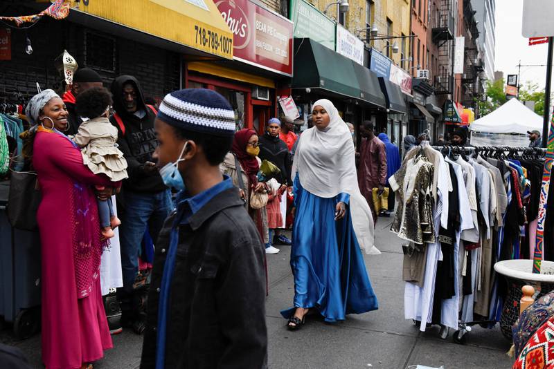 Families congregate on the street during Eid Al Fitr celebrations in New York. Reuters