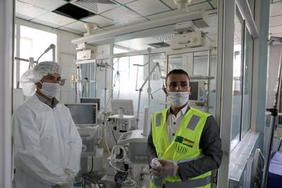 A nurse and a trainer during a lesson on how to operate ventilators recently provided by the World Health Organisation, in an intensive care ward for coronavirus patients in Sanaa. Reuters, file