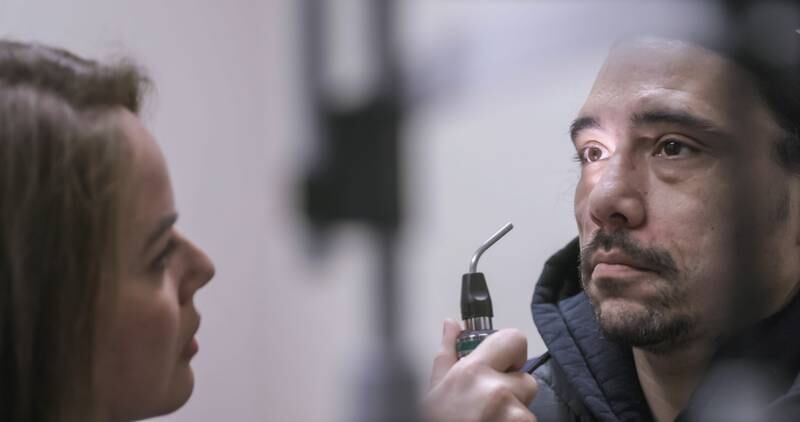 One of the trial participants, Greg, undergoes an eye exam, in this still from The Human Trial. Photo: Vox Pop Films