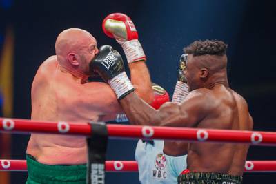 Tyson Fury and Francis Ngannou exchange punches during their fight in Riyadh. AFP