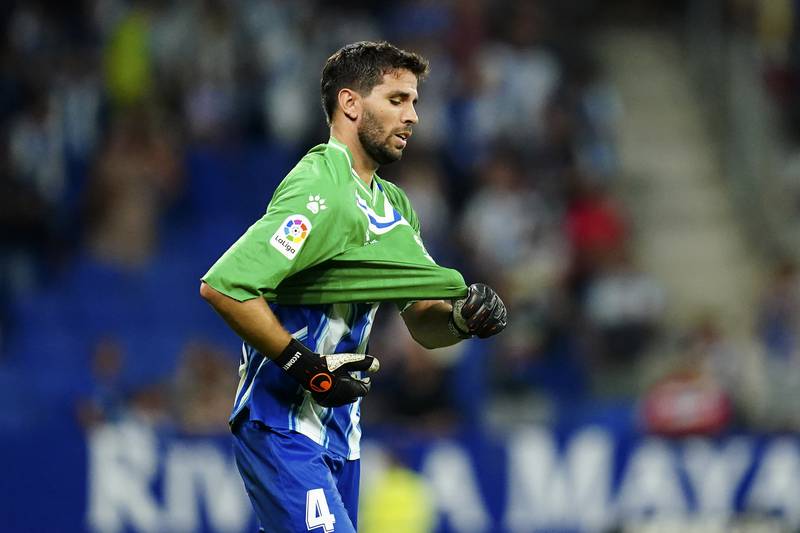 Espanyol's Leandro Cabrera puts on the goalkeeper's jersey to replace Benjamin Lecomte after he received a red card. AP