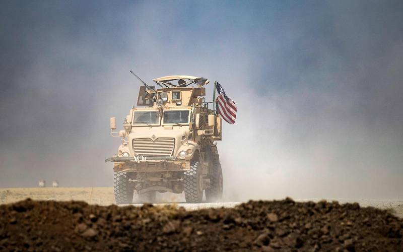 A US military vehicle patrols near the Rumaylan oil fields in Syria's Hassakeh province. AFP