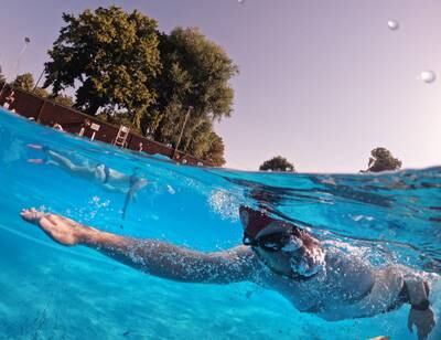 A swimmer takes an early morning dip in the cool water of Jesus Green Lido in Cambridge, eastern England. Getty Images