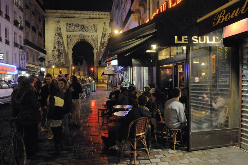 Teeming crowds pack out the street’s restaurants, cafes and food stores. AFP