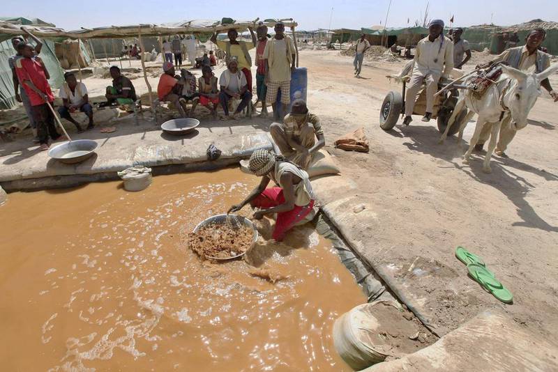 A miner pans for gold at the Wad Bushara gold mine near Abu Delelq in Sudan. About two million artisanal miners are responsible for most of the country's annual gold output. Reuters