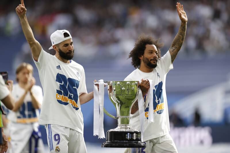 Real Karim Benzema and Marcelo hold La Liga trophy after beating Espanyol 4-0 at Santiago Bernabeu. EPA