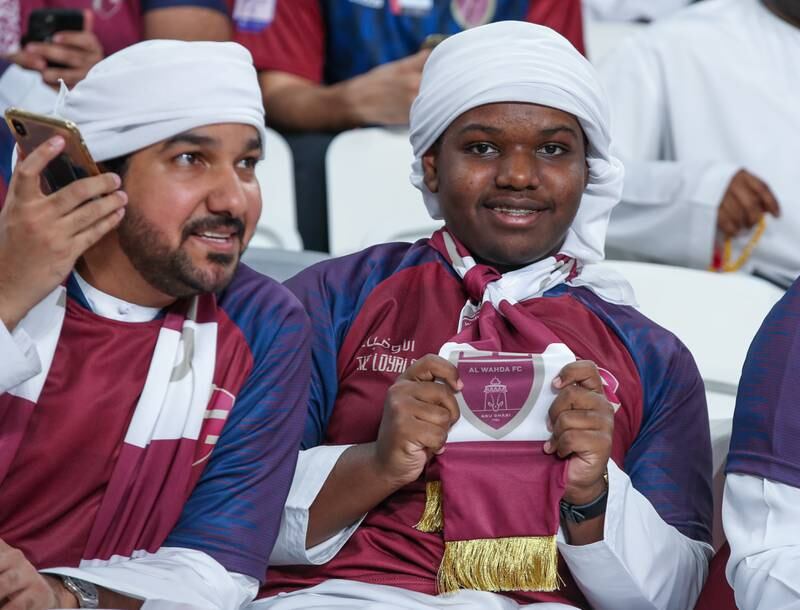 Al Wahda FC fans cheer during the President’s Cup finals at the Hazza bin Zayed Stadium in Al Ain. Victor Besa / The National