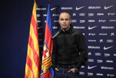 Andres Iniesta delivers a speech during his contract announcement. Lluis Gene / AFP