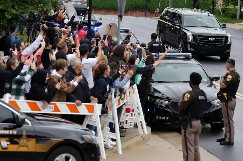 Depp waves to fans before entering the courtroom. Getty Images / AFP
