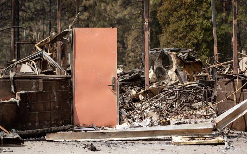 A door stands amidst the burned remains of Berry Creek School after the passage of the Bear fire, part of the larger North Lightning Complex fire, in the Berry Creek area of unincorporated Butte county, California.  AFP