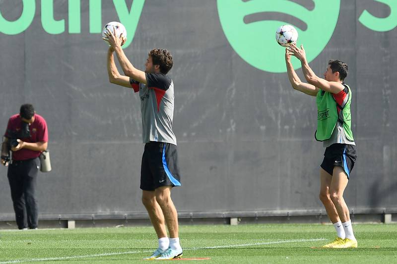 Barcelona defenders Marcos Alonso and Robert Lewandowski during training. AFP