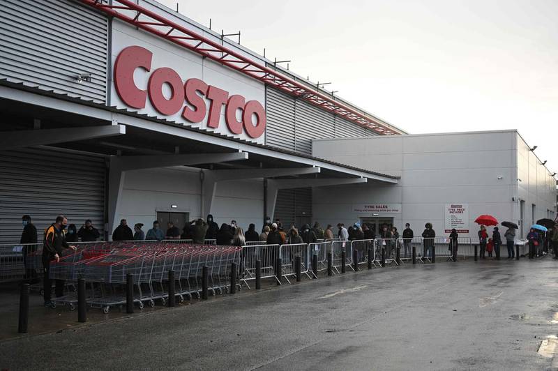 Shoppers queue outside a Costco wholesale store in Leeds. AFP