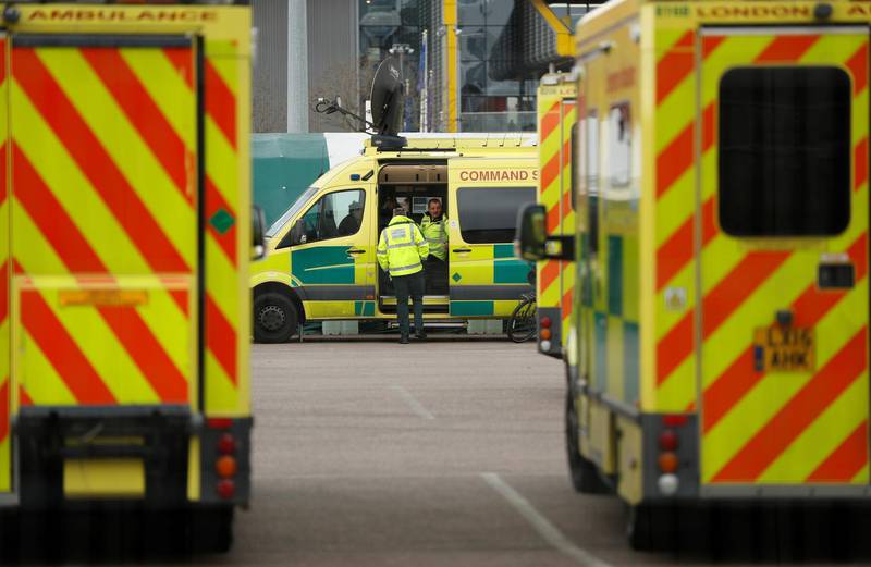 Paramedics and ambulances outside the new NHS Nightingale Hospital. Reuters