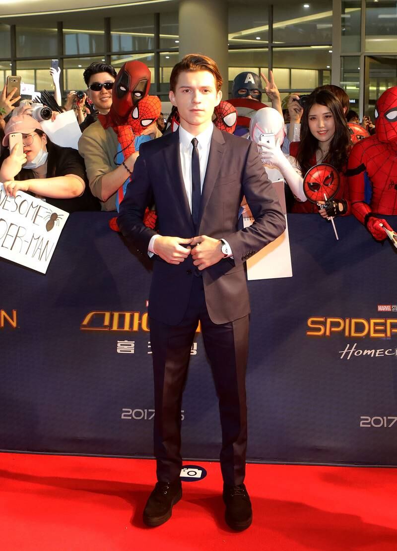 Tom Holland, in a black suit with a skinny tie, attends the 'Spider-Man: Homecoming' Seoul premiere on July 2, 2017 in South Korea. Getty Images