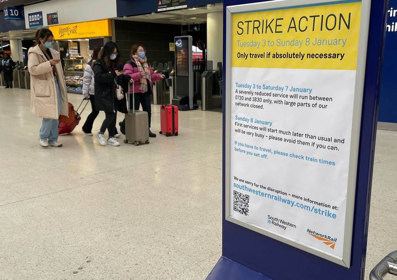 A sign at Waterloo station in London informing passengers of a strike by members of the Rail, Maritime and Transport union. PA
