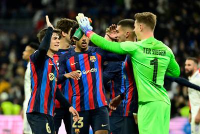 Barcelona players celebrate at the end of the Copa del Rey semi-final first leg against Real Madrid at the Santiago Bernabeu on March 2, 2023.  Barca won 1-0. AFP
