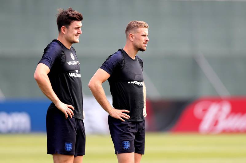 Harry Maguire and Jordan Henderson watch on during training. Alex Morton / Getty Images