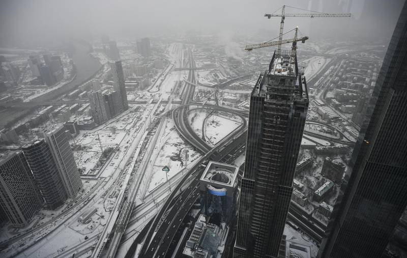 This picture taken on January 28, 2020, shows a view of the construction of the Neva towers of the Moscow International Business Centre in Moscow. (Photo by Alexander NEMENOV / AFP)