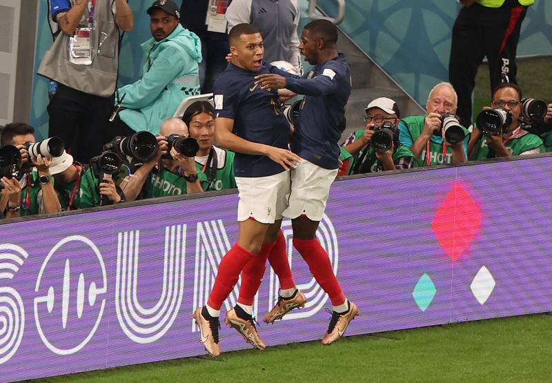 France's Kylian Mbappe celebrates scoring their third goal with Ousmane Dembele. Reuters
